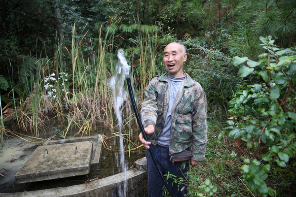 村民喝上干淨水。廖雲平攝